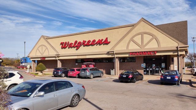 Walgreens pharmacy with a nearly full parking lot