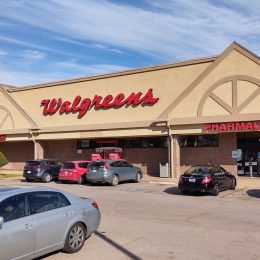 Walgreens pharmacy with a nearly full parking lot