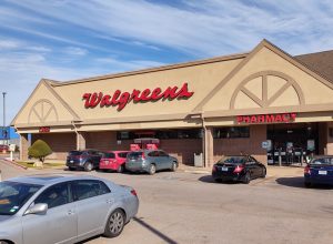 Walgreens pharmacy with a nearly full parking lot