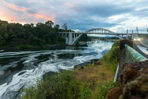 The Oregon City Bridge, also known as the Arch Bridge, is a steel through arch bridge spanning the Willamette River between Oregon City and West Linn