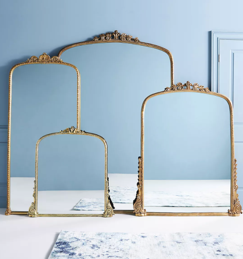Styled product shot of four different sizes of Anthropologie's Gleaming Primrose Mirrors