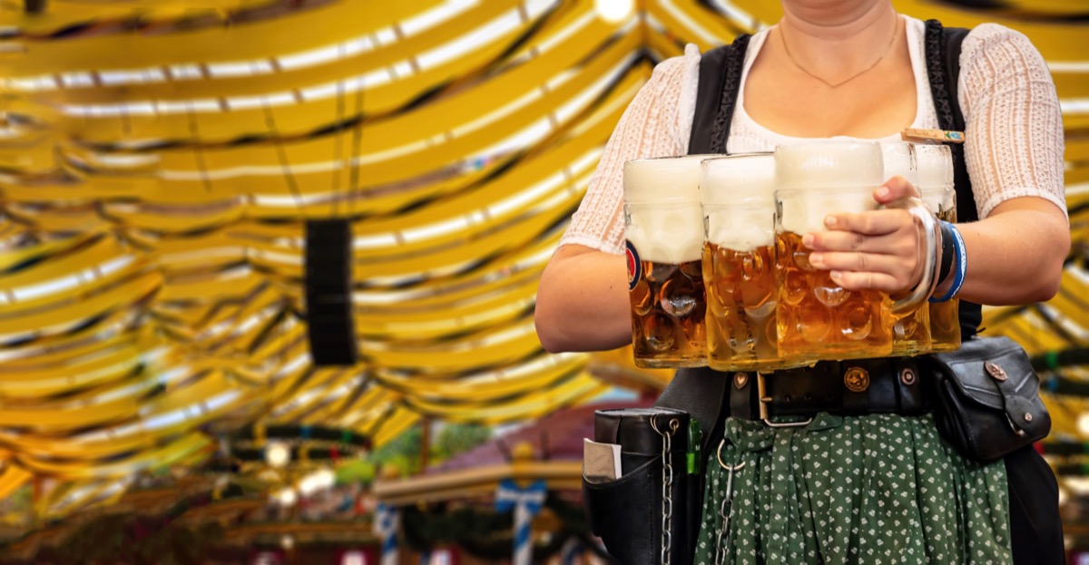 Woman server carrying beers at Oktoberfest