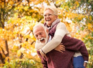 Older Man and Woman Enjoying Fall Scenery