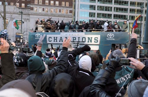 Fans cheer members of the Philadelphia Eagles organization as they celebrate their Super Bowl LII win during a parade