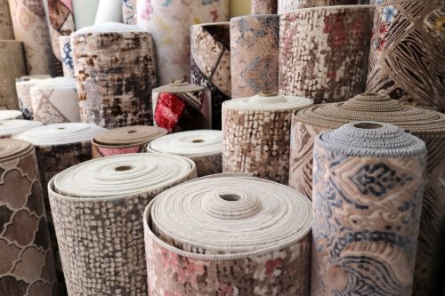 Various Rolled Up Rugs