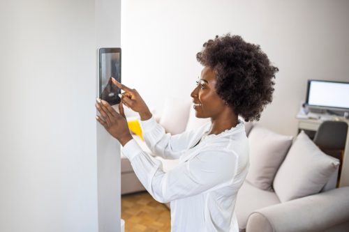 Woman Installing Home Security