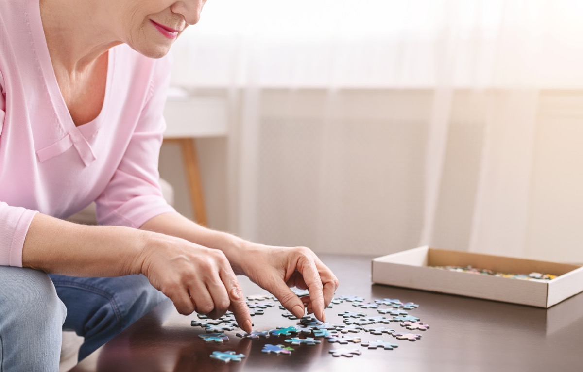 Woman Solving a Puzzle