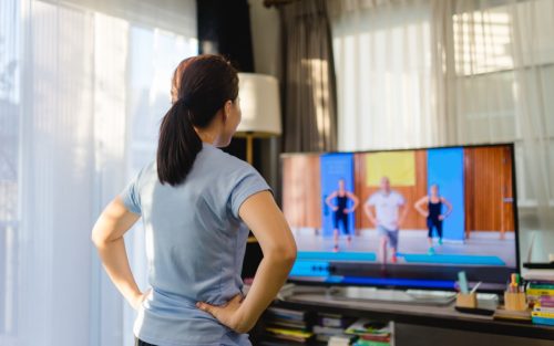 Woman Watching Workout Video at Home