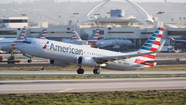 An American Airlines plane taking off from an airport