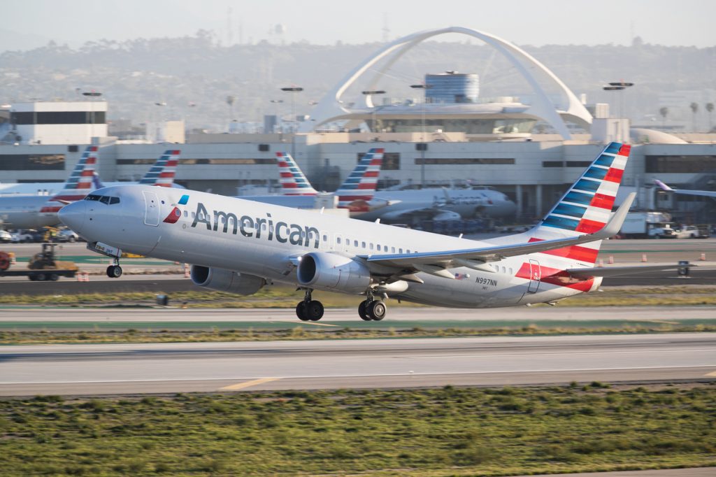 An American Airlines plane taking off from an airport