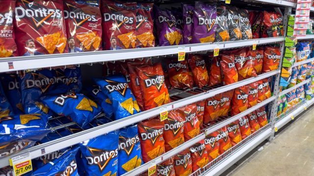 Los Angeles, California, United States - 02-01-2023: A view of several shelves dedicated to packages of Doritos chips, on display at a local grocery store.