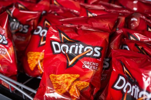 Los Angeles, California, United States - 09-04-2019: A view of several small bags of Doritos Nacho Cheese chips, on a shelf at a convenient store.