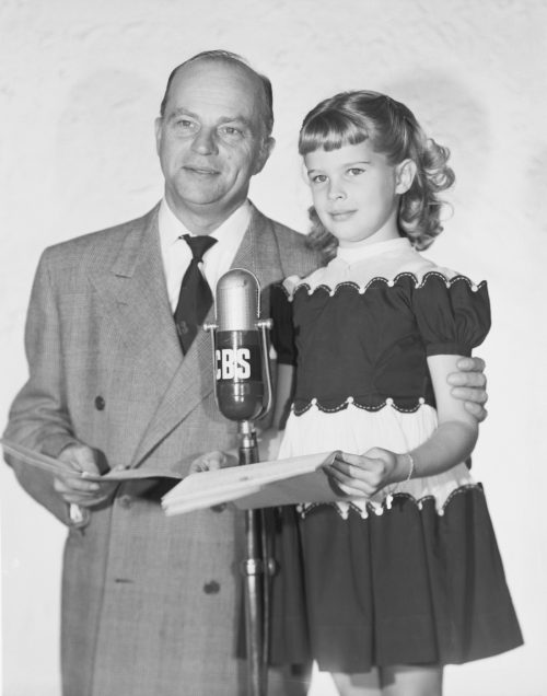 Edgar and Candice Bergen standing behind a CBS microphone in 1952