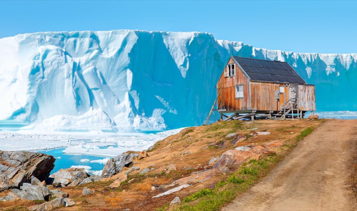 Red house in settlement of Tiniteqilaaq on Sermilik Fjord, East Greenland