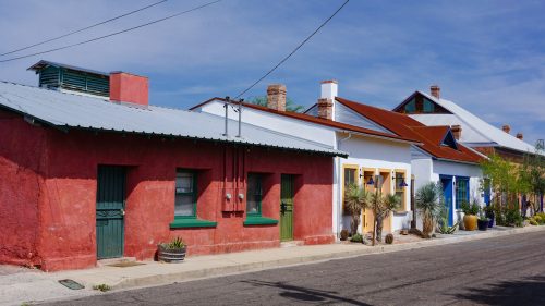 Tucson, Arizona USA - July 24, 2019: Historic adobe houses on Meyer Street in the old Presidio area of downtown Tucson, Arizona painted in brilliant colors under a summer sky