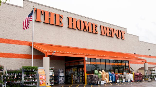 A home depot storefront with chairs and other items for sale
