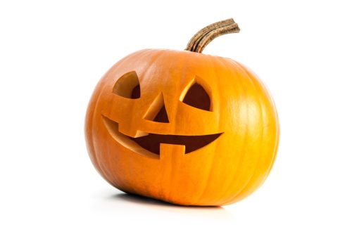 Funny carved Halloween pumpkin isolated on white background