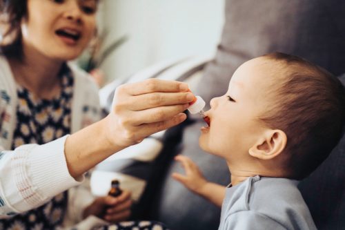 baby receiving oral medicine