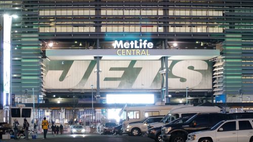 Metlife Stadium lit up at night for the Jets football team