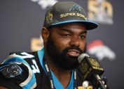 Michael Oher at a Carolina Panthers press conference for Super Bowl 50 in 2016