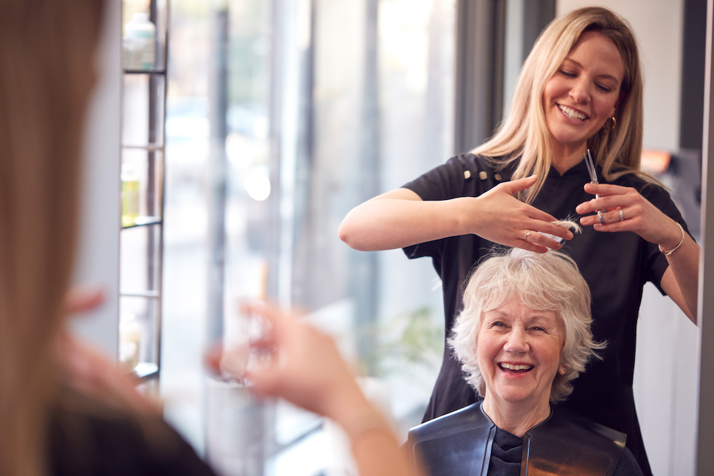 Senior woman at hair salon getting haircut