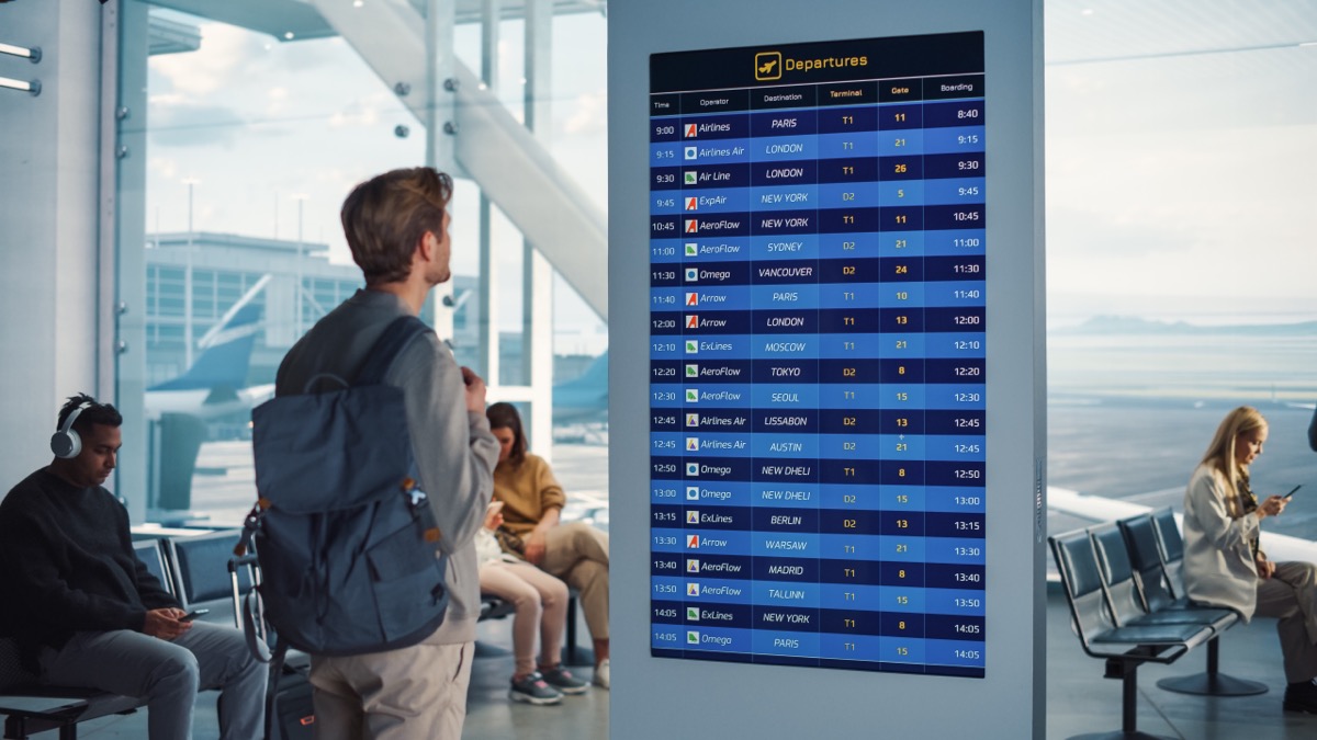 traveler looking at flight schedules