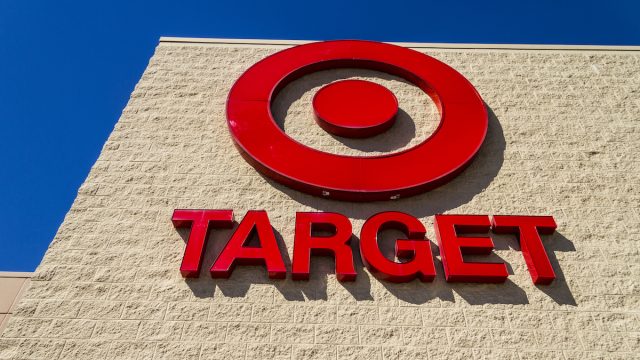 Close up of a Target bullseye and store name on a store front.