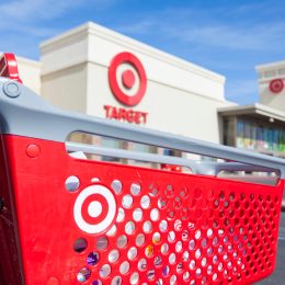 A Target shopping cart in front of a storefront
