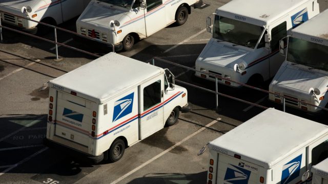 Watsonville, California, USA - January 1, 2023: A USPS (United States Postal Service) mail truck parks for the evening.