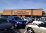 Walmart store and parking lot on a busy Saturday afternoon. Walmart is the largest retailer in the world. Photographed with an iPhone.