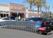 Cerritos, California, USA - April 18, 2016: Carts in parking lot are being pushed by CartManager XD, a shopping cart pusher, to make cart retrieval more efficient and safe.