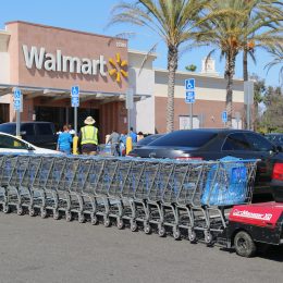 Cerritos, California, USA - April 18, 2016: Carts in parking lot are being pushed by CartManager XD, a shopping cart pusher, to make cart retrieval more efficient and safe.