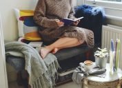 Woman sitting in an cozy reading nook