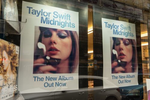Posters for Taylor Swift's "Midnights" album in store window