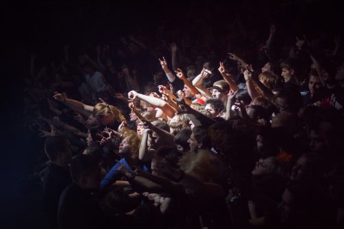 SAINT PETERSBURG, RUSSIA - MAY 1 2013: crowd of fans at the concert, fans in the spotlight. Moshing on the metal concert