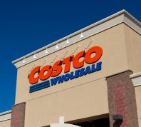A close up of a Costco sign on a storefront