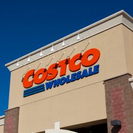 A close up of a Costco sign on a storefront