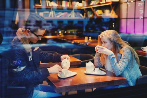 Man and woman having tea at a cafe