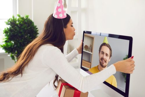 a woman sending her boyfriend happy birthday wishes over zoom
