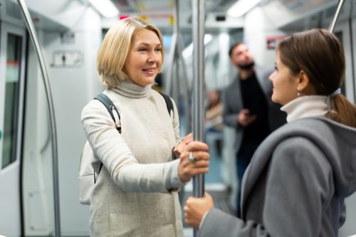 woman figuring out how to respond to a compliment from a female stranger on the train