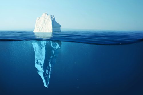 iceberg half emerged in water