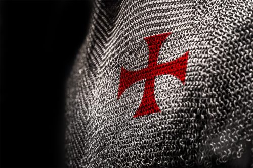 Medieval chainmail armour with a red cross on chest area