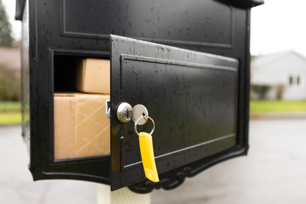 A locking mailbox with packages inside