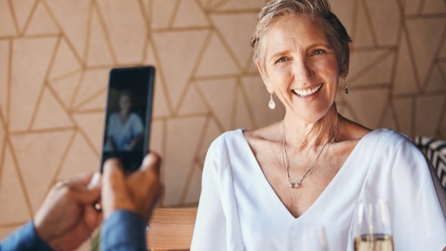Mature woman posing for photo on date