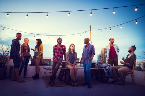 group of people hanging out at a rooftop party