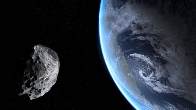 asteroid flying by earth