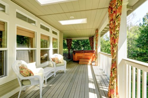 porch with floral curtains