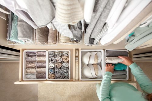 woman organizing drawers