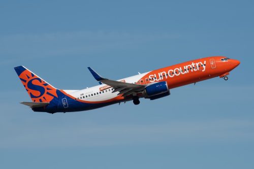 sun country airlines airplane in flight