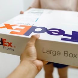 fedex package being handed to customer